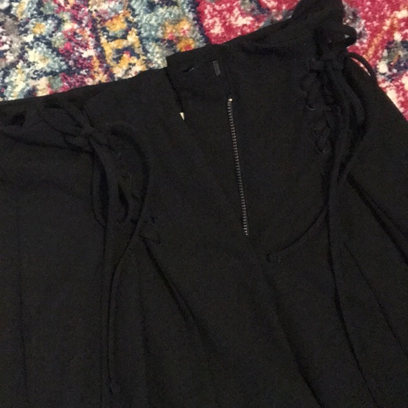 High-waisted pleated pants with lace-up features. - Picture 3 of 3